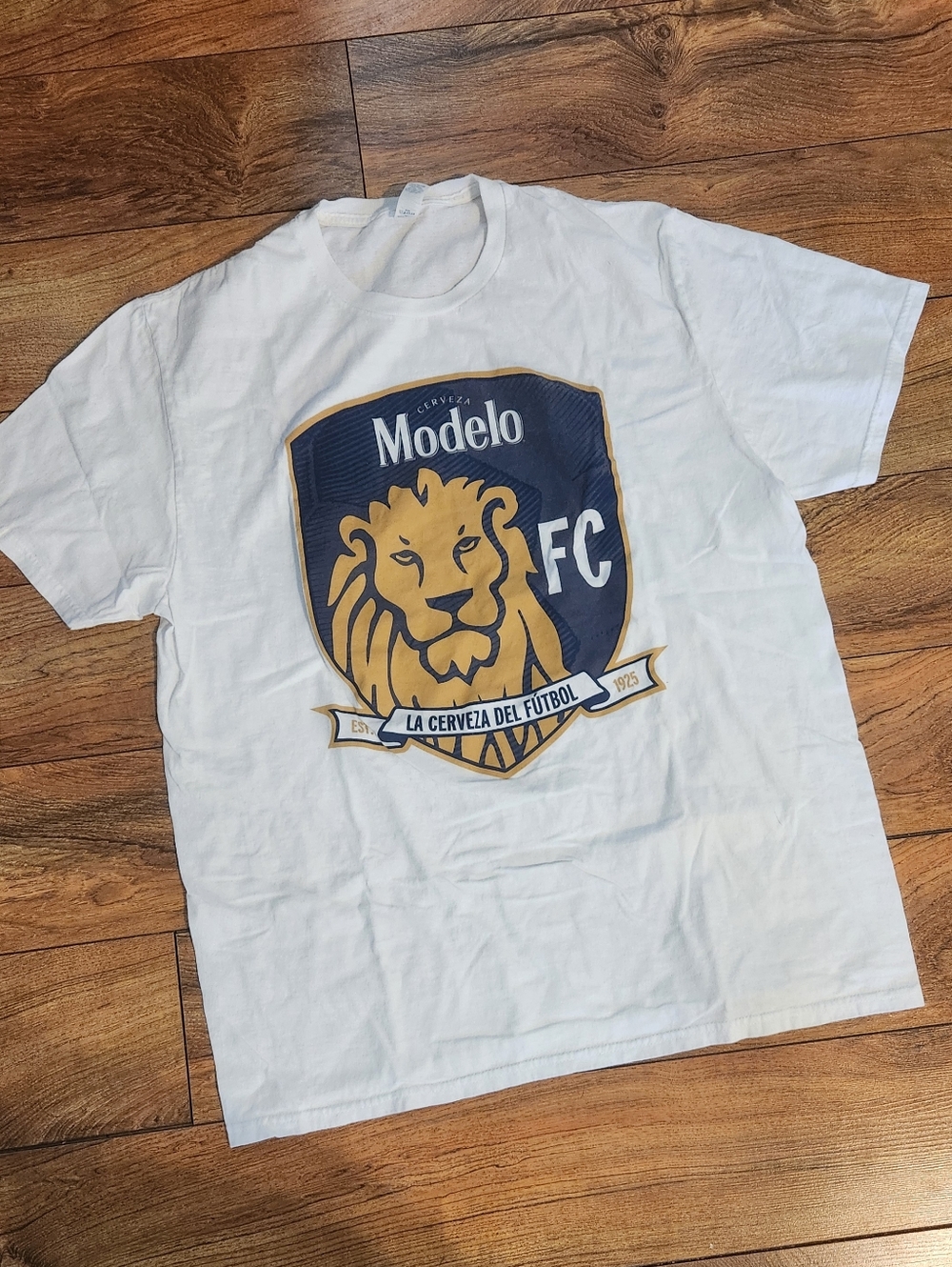 Modelo White T-Shirt with Navy and Gold Lion Crest, Size L